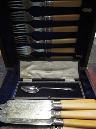 A cased silver teaspoon and a set of 6 silver plated fish knives  and forks