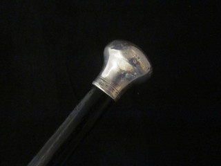 An ebony evening cane with silver knob