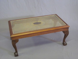 A rectangular walnut coffee table with woven cane panel to the centre, raised on cabriole supports 36"