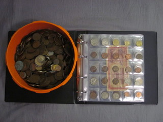 An album of various coins etc
