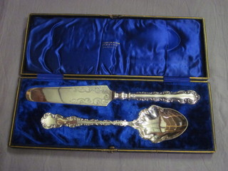 A silver plated cake knife and spoon by Elkingtons