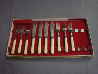 A set of 4 silver plated fish knives and forks
