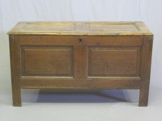 An 18th Century oak coffer of panelled construction with hinged lid 45"  ILLUSTRATED