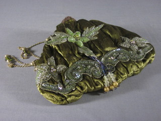 A lady's green fabric evening bag