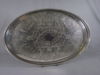 A silver plated galleried tea tray with engraved decoration 18"