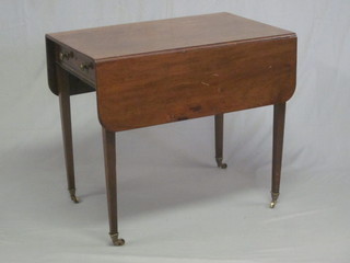 A 19th Century mahogany Pembroke table, fitted a drawer and  raised on square tapering supports ending in brass caps and castors 32"