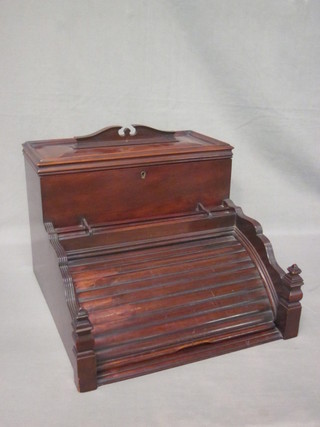 A Victorian mahogany stationery/writing slope with hinged lid enclosed by a tambour shutter 14"