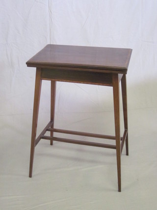 An Edwardian rectangular inlaid mahogany card table, raised on  square tapering supports 20"