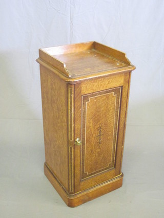 A Victorian scumble painted pedestal pot cupboard with three-quarter gallery enclosed by a panelled door, 15"