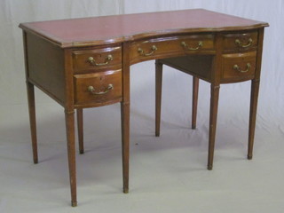 A 19th Century oak writing table with inset writing surface fitted 1 long and 4 short drawers, raised on square tapering supports by  Collinson & Lock of London 42"