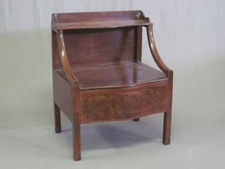 A 19th Century mahogany commode with hinged lid raised on  square supports 24"