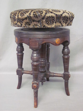 A Victorian inlaid mahogany revolving adjustable piano stool