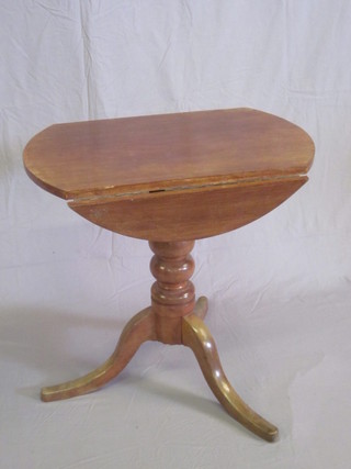 A Victorian circular mahogany drop flap pedestal table, raised on  pillar and tripod supports