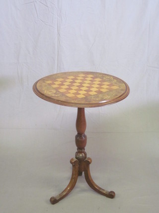 A Victorian circular figured walnut snap top chess table, raised  on a turned column and tripod base, 20"