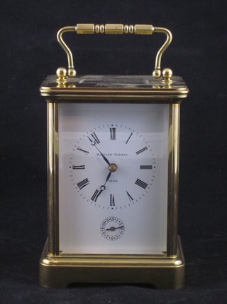 A striking carriage alarm clock contained in a gilt metal case with enamelled dial and Roman numerals by Matthew Norman,  movement numbered 1750