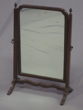 A rectangular 19th Century plate dressing table mirror contained in a mahogany swing frame 14"