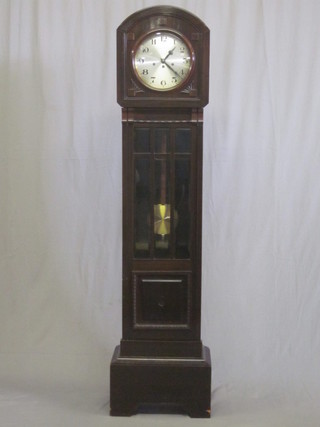 A 1920's 8 day chiming longcase clock with silvered dial  contained in an arched mahogany case 71"