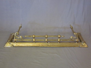 An Art Nouveau railed brass fire curb, 55"
