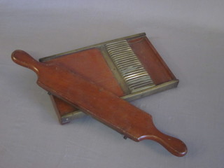 A 19th Century mahogany and brass pill roller