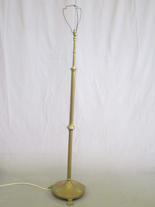 A brass adjustable standard lamp