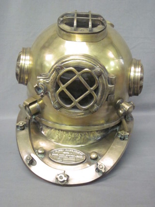 A reproduction brass diver's helmet marked US Navy Diving  helmet Mk 5  ILLUSTRATED