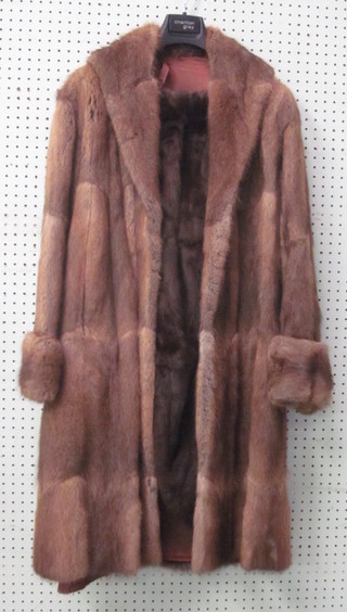 A lady's 3/4 length fur coat and stole