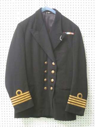 A Merchant Navy Captain's tunic by Gieves with naval insignia