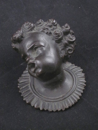 An 18th/19th Century bronze portrait plaque of a cherub 4"   ILLUSTRATED