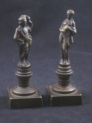 A pair of 19th Century bronze figures of standing classical lady and gentleman, raised on square bases 5 1/2"   ILLUSTRATED