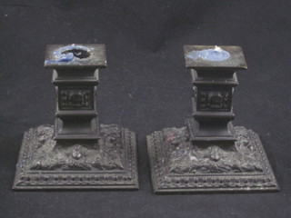 A pair of 19th Century square bronze stub shaped candlesticks 3 1/2"