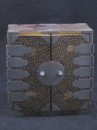 A miniature Oriental lacquered cabinet fitted 4 long drawers  enclosed by panelled doors 4"