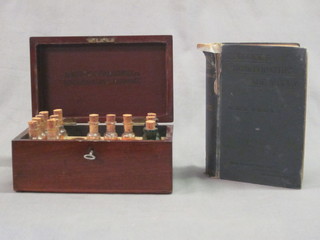 A small 19th Century rectangular apothecaries cabinet fitted  various bottles by Ashton & Parsons Ltd, together with 1 volume  Harris Ruddock - The Homeopathic Vade Mecum Medical and  Surgical