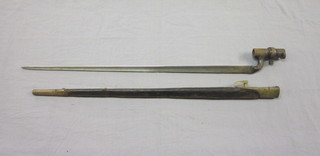 An 18th/19th Century socket bayonet 21 1/2" complete with  leather and brass scabbard