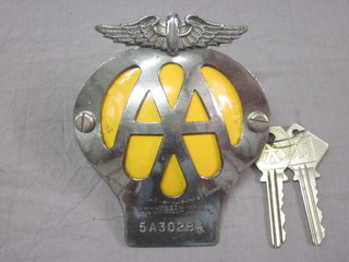 An AA beehive car badge and 2 AA keys