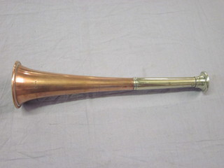 A copper and chrome hunting horn marked Made in England