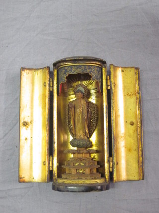 An oval Eastern lacquered shrine containing a figure of a standing Deity 3"