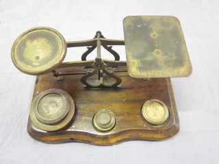 A pair of brass letter scales