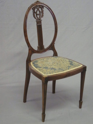 An Edwardian Hepplewhite style mahogany bedroom chair with  slat back raised upholstered seat and raised on tapering supports