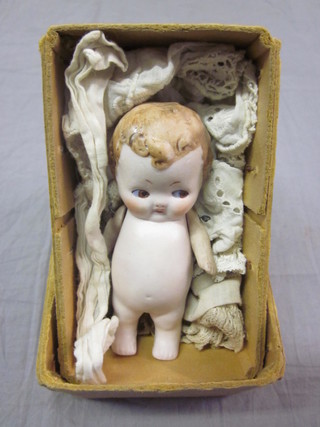 A German biscuit porcelain doll with articulated limbs 3"
