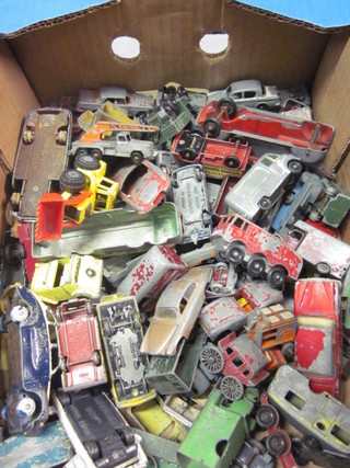 A collection of various toy cars, all play worn