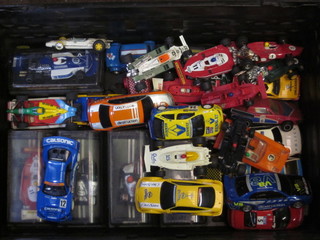 A collection of various Scalextric and other slot racing cars