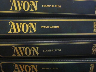 4 Avon green loose leaf albums of World stamps