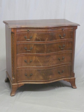 A Chippendale style mahogany chest of serpentine outline with brushing slide above 4 long drawers with canted corners, raised  on bracket feet 31"