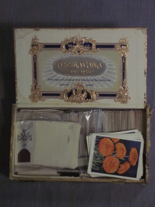 A cigar box containing a collection of Player's cigarette cards