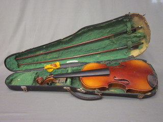 A violin with 2 piece back by Boosey & Hawkes, complete with  2 bows and carrying case