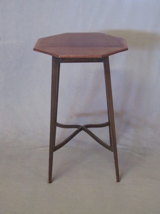 An Edwardian octagonal inlaid mahogany occasional table with X framed stretcher, raised on square tapering supports 17"
