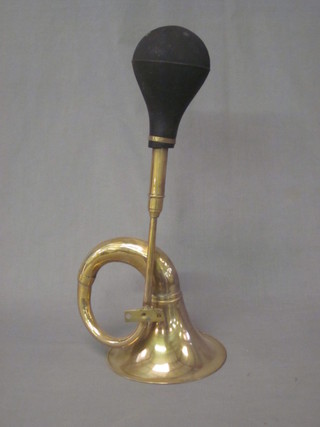 A reproduction brass taxi horn