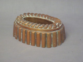An oval copper jelly mould 8"