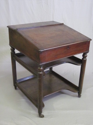 A 19th Century mahogany clerk's slope with hinged lid, the base fitted 2 shelves, raised on turned supports 26"