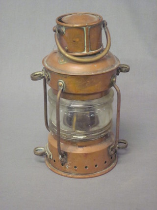 A cylindrical copper ships style lantern marked Anchor 10"